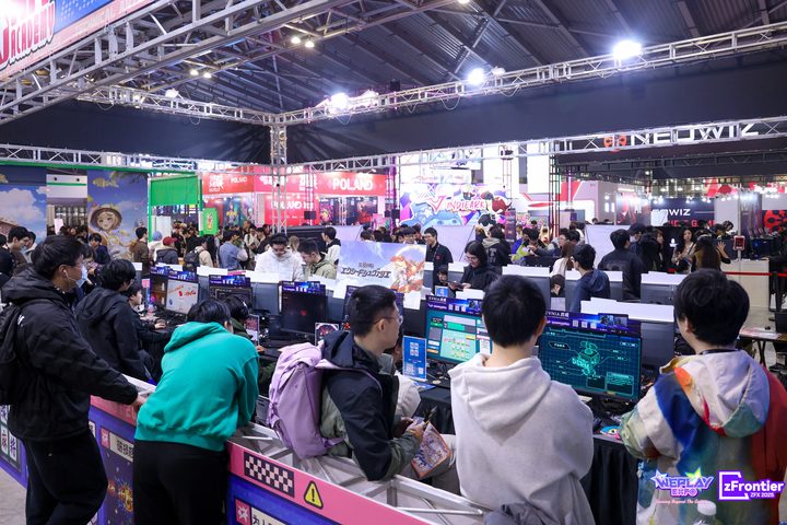 An exhibitor booth lined with demo stations at a past WePlay Expo