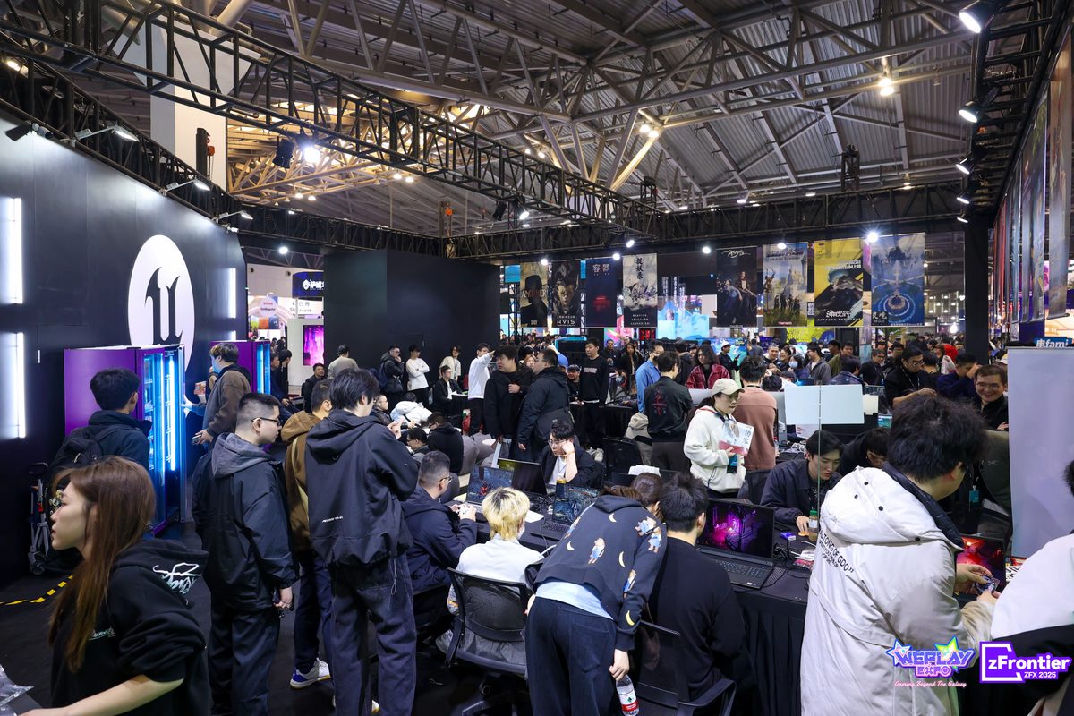Visitors exploring the game demo area at WePlay Expo